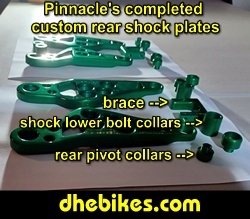 Pinnacle Innovations picture showing completed custom made and anodized suspension plates for two Norco custom downhill bike's long travel rear suspension linkage plates made from 6061 aircraft aluminum.
