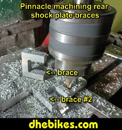 Pinnacle Innovations picture showing machining in progress of the rear shock braces for two Norco custom downhill bike's long travel rear suspension linkage plates made from 6061 aircraft aluminum.

