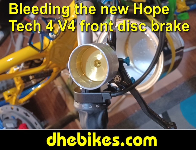 Pinnacle Innovations picture showing bleeding the new Hope Tech 4 Version 4 Downhill Mountain Bike Disc Brakes for a Norco custom electric downhill bike.