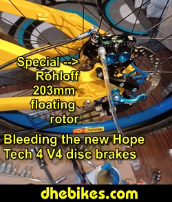 Pinnacle Innovations picture showing bleeding the new Hope Tech 4 Version 4 Downhill Mountain Bike Disc Brakes for a Norco custom electric downhill bike.